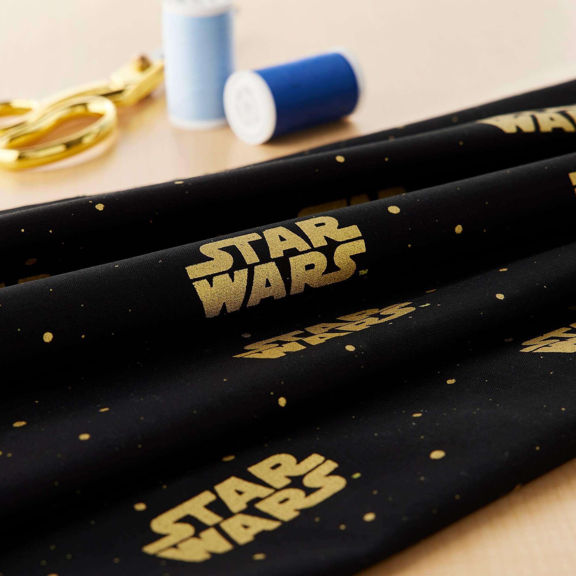 Camelot® Fabrics Star Wars™ Metallic Gold Logo on Black Cotton Fabric